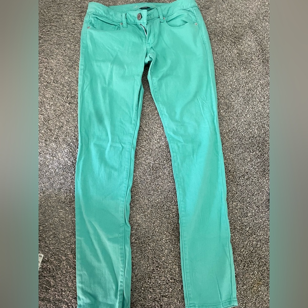NWOT American Eagle mint green skinny jeans.